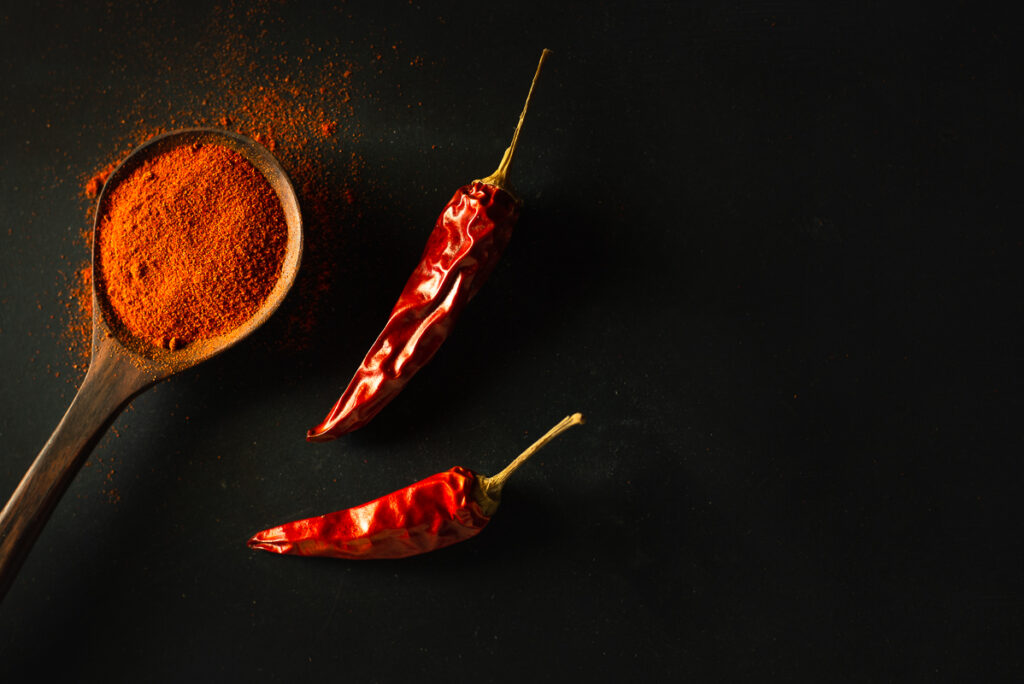 Hungarian red paprika in wooden spoon