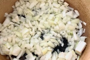 Diced onion in oil in pot