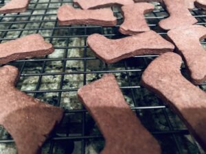 Bootie shape cookies on a cooling rack